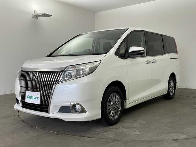 トヨタ エスクァイア Gi 兵庫県 2015(平27)年 7.6万km ホワイトパールクリスタルシャイン ・純正9インチSDナビ＆フルセグ＆BT＆DV/・バックカメラ/・両側パワースライドドア/・ビルトインETC/・社外前方ドライブレコーダー/・合皮シート/・前席シートヒーター/・革巻きステアリング/・ステアリングリモコン/・LEDヘッドライト/・フォグ/・オートライト/・オートマチックハイビーム/・2列目サンシェード/・クルーズコントロール/・スマートキー/・プッシュスタート/・純正15インチアルミホイール/・横滑り防止装置/・アイドリングストップ/・純正フロアマット
