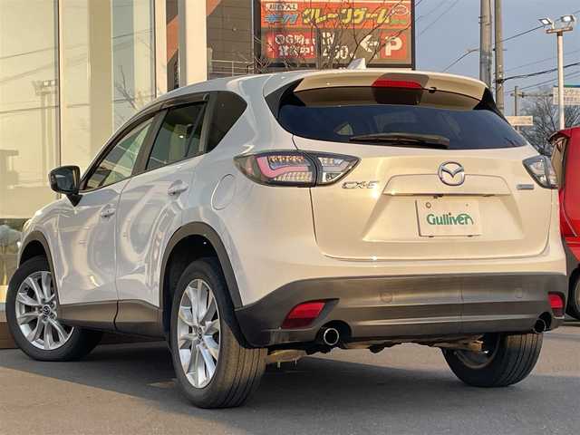 マツダ ＣＸ－５ XD Lパッケージ 道央・札幌 2012(平24)年 10.2万km クリスタルホワイトパールマイカ ・４WD/・衝突軽減ブレーキ/・ディーゼルターボ/・社外オーディオ/　CD＆DVD＆BT/・バックカメラ/・レザーシート/・シートヒーター/・パワーシート/・オートエアコン/・オートライト/・レインセンサーワイパー/・オートリトラミラー/・アイドリングストップ/・MT付きAT/・ETC/・純正エンジンスターター/・プッシュスタート/・スマートキー/・HIDヘッドライト/・クルーズコントロール/・ドライブレコーダー/・純正フロアマット/・ドアバイザー/・ウィンカーミラー/・フォグライト
