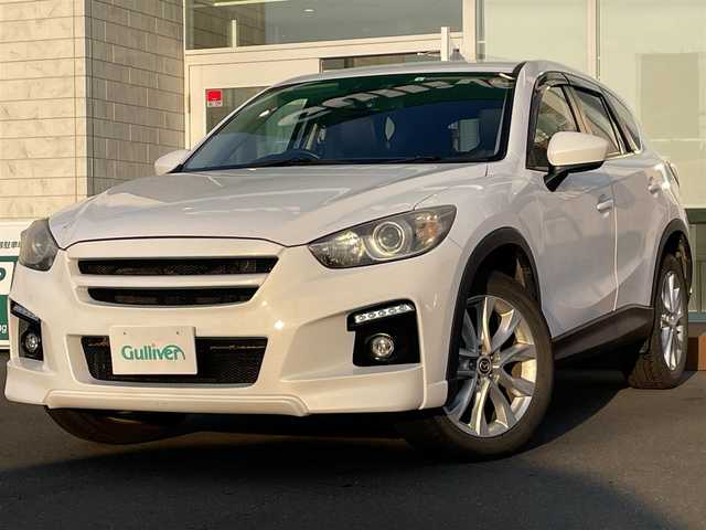 マツダ ＣＸ－５ XD Lパッケージ 道央・札幌 2012(平24)年 10.2万km クリスタルホワイトパールマイカ ・４WD/・衝突軽減ブレーキ/・ディーゼルターボ/・社外オーディオ/　CD＆DVD＆BT/・バックカメラ/・レザーシート/・シートヒーター/・パワーシート/・オートエアコン/・オートライト/・レインセンサーワイパー/・オートリトラミラー/・アイドリングストップ/・MT付きAT/・ETC/・純正エンジンスターター/・プッシュスタート/・スマートキー/・HIDヘッドライト/・クルーズコントロール/・ドライブレコーダー/・純正フロアマット/・ドアバイザー/・ウィンカーミラー/・フォグライト
