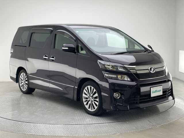 トヨタ ヴェルファイア 2．4Z ゴールデンアイズⅡ 兵庫県 2014(平26)年 7.7万km ボルドーマイカメタリック 社外SDナビ/（AM/FM/CD/DVD/Bluetooth/フルセグTV）/・NSZT-W64G/バックカメラ/クルーズコントロール/くクリアランスソナー/横滑り防止装置/カーテンエアバッグ/コーナーセンサー（前後）/パワーバックドア/両側パワースライドドア/フリップダウンモニター/オートライト/ビルトインETC/純正18インチアルミホイール/純正フロアマット/ドアバイザー/スマートキー/スペアキー1本