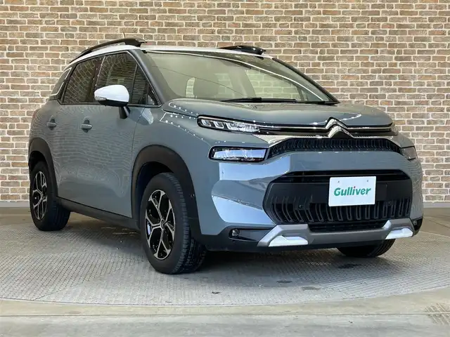 シトロエン Ｃ３ エアクロス シャイン 岩手県 2022(令4)年 1.5万km 緑 純正ディスプレイオーディオ/FM/USB/Bluetooth/バックカメラ/ETC/ドライブレコーダー/クルーズコントロール/衝突被害軽減ブレーキ/レーンキープアシスト/横滑り防止装置/アイドリングストップ/ブラインドスポットモニター/ハーフレザーシート/オートライト/LEDヘッドライト/オートワイパー/スマートキー/プッシュスタート/電動格納ミラー/純正16インチAW/純正フロアマット/ルーフレール/ワイヤレススマホ充電