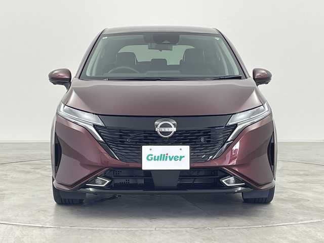 日産 オーラ G レザーエディション 群馬県 2024(令6)年 0.8万km バーガンディー BOSEパーソナルプラスサウンドシステム　純正9型ナビ　全周囲カメラ　衝突被害軽減ブレーキ　置くだけ充電　デジタルインナーミラー　ステアリングヒーター　アダプティブクルーズコントロール　LED　禁煙車