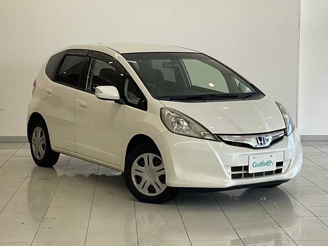 ホンダ フィット XH 新潟県 2012(平24)年 6.7万km プレミアムホワイトパール 4WD/純正インターナビ(VXM-128VSXi)/CD/DVD/USB/ワンセグテレビ/バックカメラ/ETC/クルーズコントロール/シートヒーター /ミラーヒーター/ステアリングスイッチ/スマートキー/キセノンヘッドライト/オートライト/社外15インチAW夏タイヤ車載