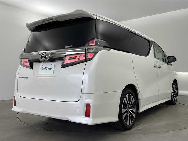 トヨタ ヴェルファイア Z Gエディション 兵庫県 2018(平30)年 7.8万km ホワイトパールクリスタルシャイン ・トヨタセーフティーセンス/・プリクラッシュセーフティ/・レーンディバチャーアラート/・パーキングサポートブレーキ/・クリアランスソナー/・ロードサインアシスト/・オートマチックハイビーム/・レーダークルーズコントロール/・先行車発進お知らせ/・アルパインナビ＆TV＆BT＆DVD＆SD&CD&HDMI/・アルパインフリップダウンモニター/・バックカメラ/・両側パワースライドドア/・前席シートヒーター/・前席ベンチレーション/・運転席メモリーシート/・前席パワーシート/・ステアリングヒーター/・デジタルインナーミラー/・ビルトインETC/・ウッドコンビハンドル/・AC100V電源/・スマートキー/・プッシュスタート/・パワーバックドア/・LEDヘッドライト/・LEDフォグランプ/・オートライト/・助手席オットマン/・2列目オットマン/・純正18インチアルミホイール