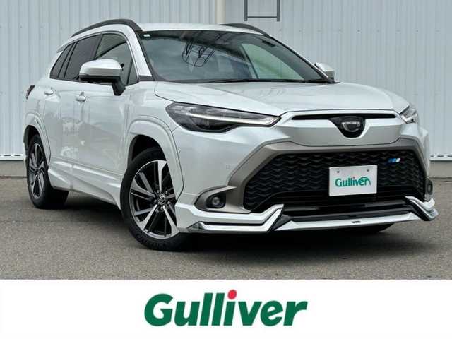 トヨタ カローラ クロス Z 愛媛県 2024(令6)年 1.4万km プラチナホワイトパールマイカ 純正10.5インチディスプレイオーディオ/車載ナビ機能/Bluetooth/フルセグTV/AppleCarPlay/コネクテッドナビ/ブラインドスポットモニター/全方位モニター/ワンオーナー/クルーズコントロール追従機能有/横滑り防止機能/衝突被害軽減システム/レーンキープアシスト/純正ビルトインETC/電動リアゲート/コーナーセンサー/パーキングアシスト/アイドリングストップ/LEDオートライト/オートマチックハイビーム/純正18インチAW/純正フロアマット/ルーフレール/スマートキー/スペアキー/運転席パワーシート/シートヒーター