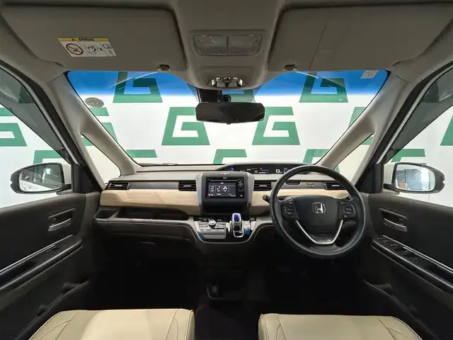 ホンダ フリード ハイブリット G ホンダセンシング 鹿児島県 2019(平31)年 5.4万km ホワイトオーキッドパール ワンオーナー　/禁煙車　/両側パワスラ　/純正ディスプレイオーディオ　/バックカメラ　/ワンセグＴＶ　/Ｂｌｕｅｔｏｏｔｈ　/ホンダセンシング　/追従型クルコン　/電格ミラー　/前席レザー調シートカバー　/ステリモ　/ＥＴＣ/ドアバイザー/後席ロール式サンシェード/純正フロアマット/スマートキー