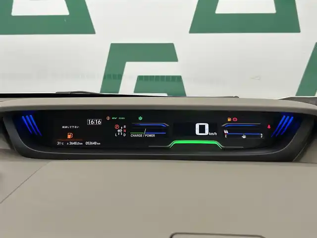 ホンダ フリード ハイブリット G ホンダセンシング 鹿児島県 2019(平31)年 5.4万km ホワイトオーキッドパール ワンオーナー　/禁煙車　/両側パワスラ　/純正ディスプレイオーディオ　/バックカメラ　/ワンセグＴＶ　/Ｂｌｕｅｔｏｏｔｈ　/ホンダセンシング　/追従型クルコン　/電格ミラー　/前席レザー調シートカバー　/ステリモ　/ＥＴＣ/ドアバイザー/後席ロール式サンシェード/純正フロアマット/スマートキー
