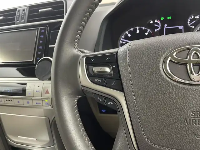 トヨタ ランドクルーザー プラド TX Lパッケージ 熊本県 2022(令4)年 6.5万km ホワイトパールクリスタルシャイン 純正SDナビ(フルセグTV/CD/DVD/BT/FM/AM)/サンルーフ/バックカメラ/トヨタセーフティセンス/・プリクラッシュセーフティ/・レーンディパーチャアラート/・クリアランスソナー/・ロードサインアシスト/・オートマチックハイビーム/・レーダークルーズコントロール/革シート/前席パワーシート/前席シートヒーター/前席シートクーラー/ステアリングリモコン/ビルトインETC/センターデフロック/純正フロアマット/スペアキー