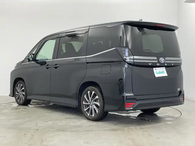 トヨタ ヴォクシー ハイブリッド S－Z 新潟県 2023(令5)年 1.4万km グリッターブラックガラスフレーク 10.5インチ純正メモリナビ/　フルセグTV/Bluetooth/CD/DVD/USB/レーダークルーズコントロール/衝突被害軽減ブレーキ/レーンキープアシスト/前後コーナーセンサー/両側パワースライドドア/ハーフレザーシート/前席シートヒーター/バックモニター/ビルトインETC/横滑り防止装置/LEDヘッドライト/オートマチックハイビーム/オートライト/ユニバーサルステップ/レザーステアリング/ステアリングスイッチ/禁煙車