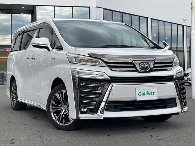 トヨタ ヴェルファイア ハイブリット Z ゴールデンアイズ 青森県 2020(令2)年 6.2万km ホワイトパールクリスタルシャイン ・4WD/・サンルーフ/・純正メーカーOPナビ/・フリップダウンモニター/・フルセグ/CD/DVD/BT/・両側パワースライドドア/・衝突軽減ブレーキ/・レーンキープアシスト/・レーダークルーズコントロール/・盗難防止装置/・前後コーナーセンサー/・ドライブレコーダー/・プッシュスタート/・スマートキー/・純正フロアマット/・オートライト/・オートマチックハイビーム/・LEDヘッドライト/・ハーフレザーシート/・社外18AW/・保証書・取説あり