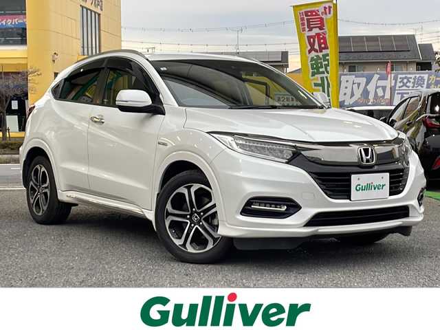 ホンダ ヴェゼル ハイブリッド Z ホンダセンシング 茨城県 2019(平31)年 7万km プラチナホワイトパール 純正SDナビ/バックカメラ/ビルトインETC/FM／AM/ドライブレコーダー（前後）/アダプティブティブクルーズコントロール/アイドリングストップ/横滑り防止装置/衝突被害軽減システム/盗難防止装置/レーンキープアシスト/シートヒーター（前席）/パドルシフト/純正フロアマット/純正17インチアルミ付夏タイヤ/純正LEDヘッドライト/純正LEDフォグライト/電格ミラー/スマートキー/プッシュスタートボタン/ドアバイザー