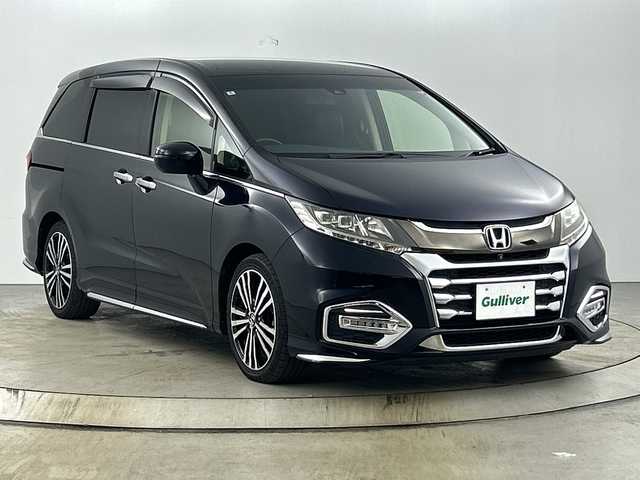ホンダ オデッセイ アブソルート・EXホンダセンジング 愛知県 2018(平30)年 7.2万km プレミアムヴィーナスブラックP 禁煙車/純正9インチナビ/（CD/DVD/Bluetooth/フルセグTV/HDMI/USB)/全方位カメラ/フリップダウンモニター/AC100V電源/ホンダセンシング/・衝突軽減ブレーキ/・誤発進抑制機能/・レーンキープアシスト/・先行車発進お知らせ機能/・アダプティブクルーズコントロール/・ブラインドスポットモニター/パーキングアシスト/ETC2.0/本革シート/パワーシート/メモリシート/オットマン/シートヒーター/両側パワースライドドア/パドルシフト/アイドリングストップ/純正18インチアルミホイール/スマートキー/スペアキー1本/プッシュスタート/LEDヘッドライト/フロントフォグランプ/純正フロアマット/横滑り防止装置/電動格納ミラー