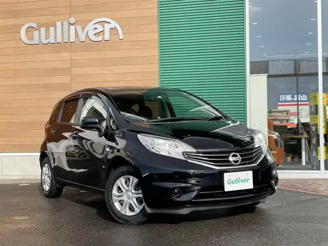 日産 ノート X FOUR エマージェンシーB 道央・札幌 2014(平26)年 5.9万km スーパーブラック 登録時走行距離 58/702ｋｍ/　４　W　D　/社外ＳＤナビ（CD/DVD/FM/AM/SD/BT）/フルセグTV（走行中視聴可）/プッシュスタート/純正フロアマット/純正ドアバイザー/社外ドライブレコーダー/衝突被害軽減装置/レーンキープアシスト/盗難防止装置/スペアキー×１/ヘッドライトレベライザー/電動格納ミラー/バニティミラー/エンジンスターター付/４ＷＤ・２ＷＤ切り替えスイッチ/積込夏タイヤ（社外ＡＷ/185/70/R14/２０年製/溝6ｍｍ）