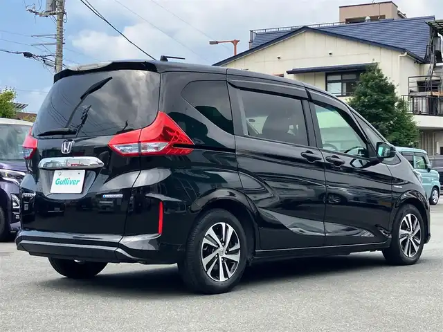ホンダ フリード＋ ハイブリット EX 静岡県 2017(平29)年 7.1万km クリスタルブラックパール ワンオーナー/純正Hondaインターナビ/CD /DVD /SD /USB /BT /HDMI /フルセグ/ビルトインETC車載器(ナビ連動)/バックカメラ/Honda SENSING/スマートキー/スペアキー１本/イモビライザー/両側パワースライドドア/LEDヘッドライト/AFS/アクティブコーナリングライト/センターテーブル/運転席＆助手席シートヒーター/コンフォートビューパッケージ/親水/ヒーテッドドアミラー/熱線入りフロントウインドウ＋フロントドア撥水ガラス/保証書/記録簿/エンジンスタートボタン/パワーウィンドウ/パワーステアリング/寒冷地仕様/アイドリングストップ/ドライブレコーダー/横滑り防止装置/レーンキープアシスト/W+サイドエアバック/カーテンエアバック/衝突軽減システム
