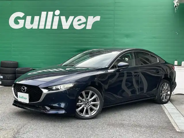 マツダ マツダ３セダン 20S Lパッケージ 東京都 2020(令2)年 2.1万km ディープクリスタルブルーマイカ 純正SDナビ/(AM/FM/CD/DVD/フルセグTV/Bluetooth)/360度セーフティパッケージ/レーダークルーズコントロール/クルージングトラフィックサポート/スマートブレーキサポート/交通標識認識システム/ドライブレコーダー前後/(XLDR-L2)/車線逸脱警報システム/ブラインドスッポトモニター/パーキングセンサー前後/ヘッドアップディスプレイ/純正フロアマット/パワーシート/前席シートヒーター/ステアリングヒーター/ETC/スペアキー×1/取扱説明書