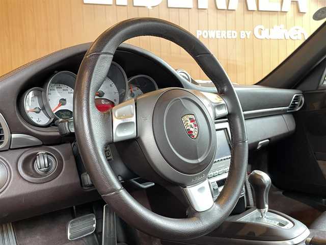 ポルシェ ９１１ カレラS 宮城県 2005(平17)年 7.5万km シールグレー スポーツクロノパッケージ/PASM/サンルーフ/ブラウンレザーインテリア/社外HDDナビ/バックカメラ/メモリ機能付きパワーシート/シートヒーター/キセノンヘッドライト/クルーズコントロール/純正19インチAW/レッドブレーキキャリパー/キーレスキー/ETC