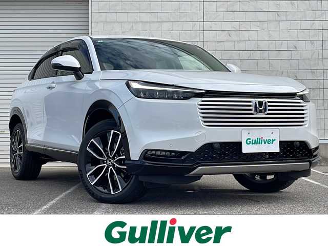 ホンダ ヴェゼル ハイブリッド e:HEV Z 新潟県 2025(令7)年 0.1千km プラチナホワイトパール ワンオーナー/４WD/純正9インチナビ/(AM/FM/BT/フルセグ)/バックカメラ/ETC2.0/衝突軽減/BSM/パワーバックドア/アダプティブクルーズコントロール/アイドリングストップ/置くだけ充電/コーナーセンサー/ハーフレザーシート/シートヒーター/革巻きステアリング/ステアリングスイッチ/ハンドルヒーター/パドルシフト/AUTOライト/LEDヘッドライト/フォグランプ/横滑り防止/プッシュスタート/スマートキー