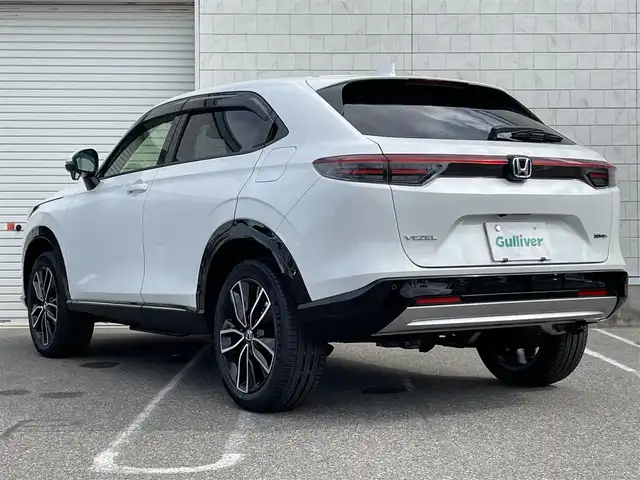 ホンダ ヴェゼル ハイブリッド e:HEV Z 新潟県 2025(令7)年 0.1千km プラチナホワイトパール ワンオーナー/４WD/純正9インチナビ/(AM/FM/BT/フルセグ)/バックカメラ/ETC2.0/衝突軽減/BSM/パワーバックドア/アダプティブクルーズコントロール/アイドリングストップ/置くだけ充電/コーナーセンサー/ハーフレザーシート/シートヒーター/革巻きステアリング/ステアリングスイッチ/ハンドルヒーター/パドルシフト/AUTOライト/LEDヘッドライト/フォグランプ/横滑り防止/プッシュスタート/スマートキー
