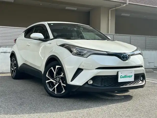 トヨタ Ｃ－ＨＲ G 大阪府 2019(令1)年 5万km ホワイトパールクリスタルシャイン OP　バックカメラ/OP　リヤクロストラフィックアラート/純正7インチSDナビ　/Bluetooth/CD/DVD/AM/FM/クルーズコントロール追従機能付き/アイドリングストップ/前後コーナーセンサー/ABS/横滑り防止機能/ブラインドスポットモニタ/オートLEDヘッドライト/フォグランプ/スペアキー×1/保証書/取扱説明書/記録簿　R7年6月　R6年6月　R5年5月　R4年6月