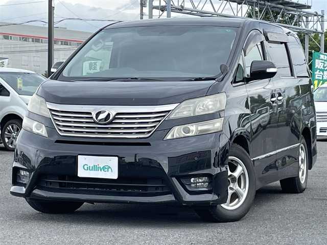 トヨタ ヴェルファイア 2．4Z プラチナセレクションⅡ 道央・札幌 2010(平22)年 15.4万km ブラック ４WD/純正メーカーナビ/CD/DVD/BT/フルセグ/純正フリップダウンモニター/横滑り防止装置/クリアランスソナー/バックカメラ/ビルトインETC/センターデフロック/両側パワースライドドア/パワーバックドア/2列目オットマン/革巻きウッドコンビステアリング/ステアリングリモコン/AC100V/MTモード付AT/プッシュスタート/スマートキー/HIDヘッドライト/オートライト/フォグランプ/電動格納ミラー/ウィンカーミラー/純正フロアマット/ドアバイザー/純正AW付夏タイヤ積込/235/50/R18/2018年/山5mm