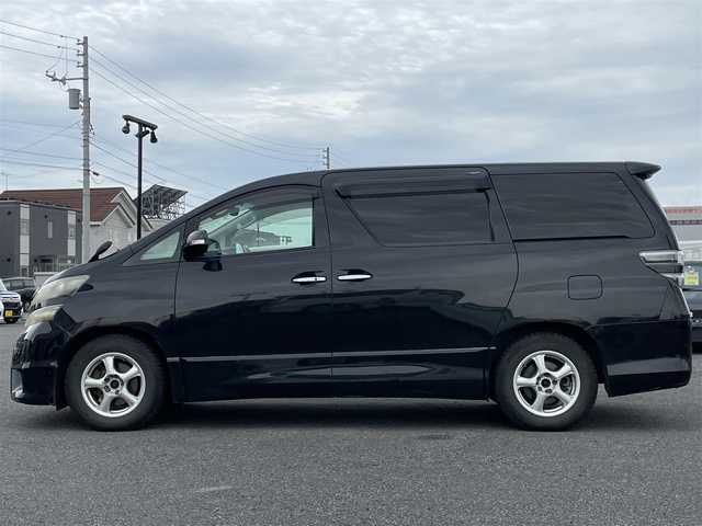 トヨタ ヴェルファイア 2．4Z プラチナセレクションⅡ 道央・札幌 2010(平22)年 15.4万km ブラック ４WD/純正メーカーナビ/CD/DVD/BT/フルセグ/純正フリップダウンモニター/横滑り防止装置/クリアランスソナー/バックカメラ/ビルトインETC/センターデフロック/両側パワースライドドア/パワーバックドア/2列目オットマン/革巻きウッドコンビステアリング/ステアリングリモコン/AC100V/MTモード付AT/プッシュスタート/スマートキー/HIDヘッドライト/オートライト/フォグランプ/電動格納ミラー/ウィンカーミラー/純正フロアマット/ドアバイザー/純正AW付夏タイヤ積込/235/50/R18/2018年/山5mm