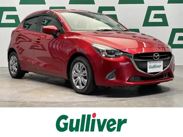 マツダ デミオ 13S 鹿児島県 2016(平28)年 1.9万km ソウルレッドプレミアムメタリック ナビ/(フルセグTV/Bluetooth/DVD/CD)/バックカメラ/前席シートヒーター/衝突軽減ブレーキ/横滑り防止/LEDヘッドライト/純正フロアマット/ドアバイザー/電動格納ミラー/アイドリングストップ/スマートキー/プッシュスタート