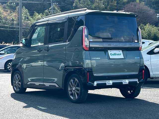 三菱 デリカミニ T プレミアム 佐賀県 2023(令5)年 2.3万km Ｄグリーン 社外9インチナビゲーション/マイパイロット/マルチアラウンドモニター/ステアリングヒーター/前席シートヒーター/デジタルインナーミラー/両側パワースライドドア/パドルシフト/社外ドライブレコーダー前後/ヒルディセントコントロール/助手席側電動スライドドア/衝突被害軽減ブレーキシステム/車線逸脱警報システム/車線維持支援機能/LEDヘッドライト/フォグランプ/純正15インチアルミホイール/スマートキー/スペアキー×１