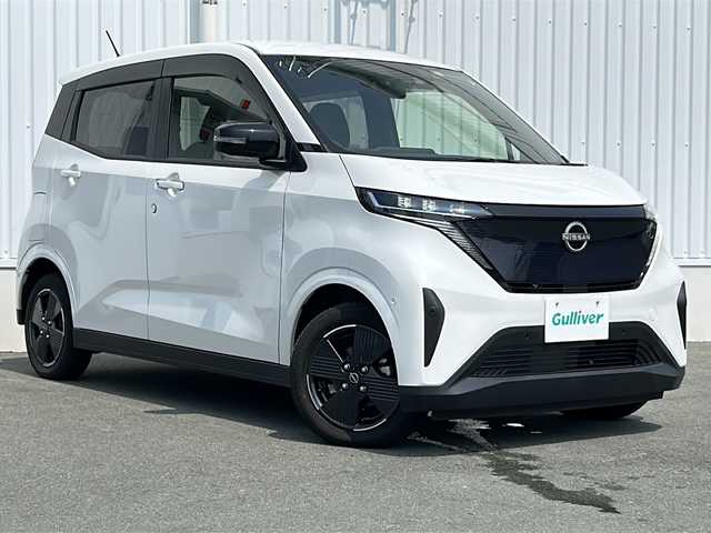 日産 サクラ G 三重県 2022(令4)年 3.1万km ホワイトパール 純正ナビ/全周囲カメラ/シートヒーター/ステアリングヒーター/ステアリングリモコン/USB・タイプC給電ポート/ハンドル支援/プロパイロット/レーダークルーズコントロール/純正フロアマット/電子パーキング/ビルトインETC2.0/電動格納ミラー/禁煙車