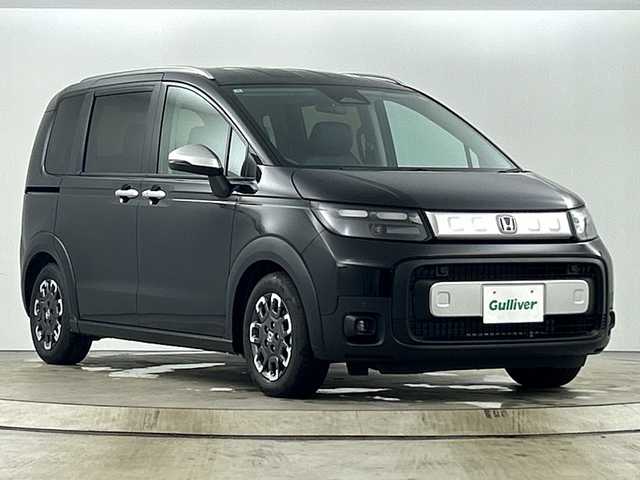 ホンダ フリード クロスター 愛知県 2025(令7)年 0.1万km未満 クリスタルブラックパール 登録済未使用車/純正9インチナビ/（フルセグTV/Bluetooth//AppleCarPlay/AndroidAuto)/バックカメラ/ホンダセンシング/。衝突軽減ブレーキ/・レーンキープアシスト/。追従式クルーズコントロール/・オートマチックハイビーム/・クリアランスソナー/・誤発進抑制機能/シートヒーター/ダウンヒルアシスト/両側パワースライドドア/LEDヘッドライト/純正15インチアルミホイール/スマートキー/横滑り防止装置