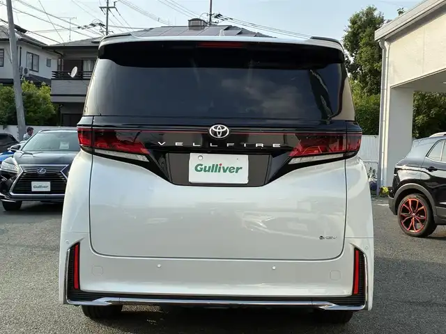 トヨタ ヴェルファイア ハイブリット Z プレミア 熊本県 2024(令6)年 0.5万km プラチナホワイトパールマイカ ワンオーナー/左右独立ムーンルーフ/トヨタチームメイト/ユニバーサルステップ/純正メーカーナビ/【フルセグTV/Bluetooth】/アランドビューモニター/デジタルインナーミラー/両側パワースライドドア/レーダークルーズコントロール/衝突被害軽減システム/ブラインドスポットモニター/パーキングサポートブレーキ/リアカメラディテクション安心降車アシスト/クリアランスソナー/レーンキープアシスト/レーンチェンジアシスト/ロードサインアシスト/プロアクティブドライビングアシスト/フロントクロストラフィックアラート/リアクロストラフィックアラート/後方車両接近装置/純正19インチAW/オートライト/LEDヘッドライト/茶レザーシート/パワーシート（メモリ付き）/シートヒーター/エアシート/後部座席オットマン/キャプテンシート/ステアリングヒーター/電動リアゲート/ビルトインETC/AC100V/USB/保証書