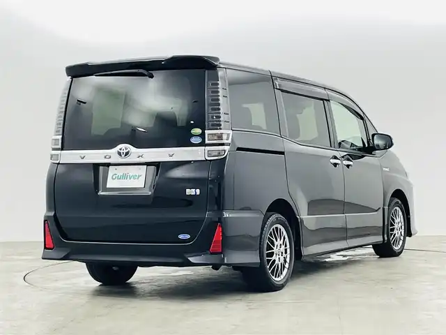トヨタ ヴォクシー ハイブリッド ZS 煌 福島県 2020(令2)年 6.3万km ブラック トヨタセーフティC/・プリクラッシュセーフティ/・レーンディパーチャーアラート/・オートマチックハイビーム/社外ナビ/・フルセグTV/BT/CD/DVD/AM・FM/HDMI/AUX/・バックカメラ/・社外後方モニター/・ETC/クルーズコントロール/革巻きステアリング/・ステアリングスイッチ/シートヒーター（D＋N）/・エアーシート（D＋N）/プッシュスタート/・スマートキー/LEDライト/・オートライト/電動格納ウィンカーミラー/ドアバイザー/純正フロアマット