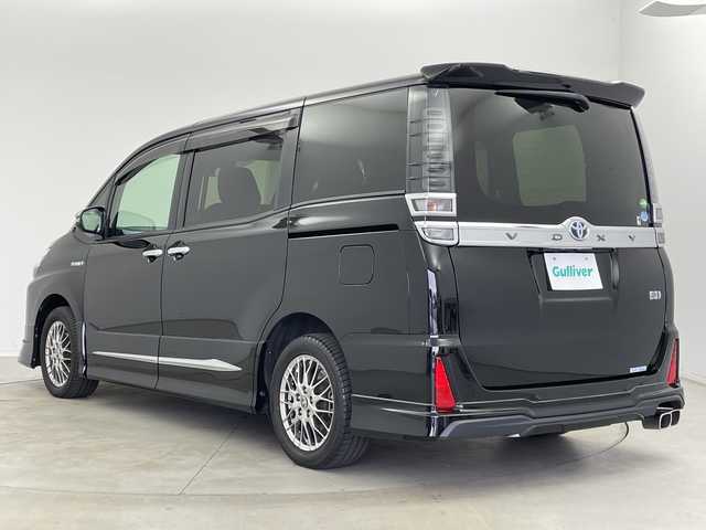 トヨタ ヴォクシー ハイブリッド ZS 煌Ⅱ 新潟県 2019(平31)年 7万km ブラック ALPAINE11型ナビ/BT/CD/DVD/フルセグ/ALPAINE12.8型フリップダウンモニター/バックカメラ/ドライブレコーダー前/トヨタセーフティセンス/コーナーセンサー前後/両側パワースライドドア/LEDヘッドライト/フォグランプ/純正フロアマット/シートヒーター/モデリスタエアロ