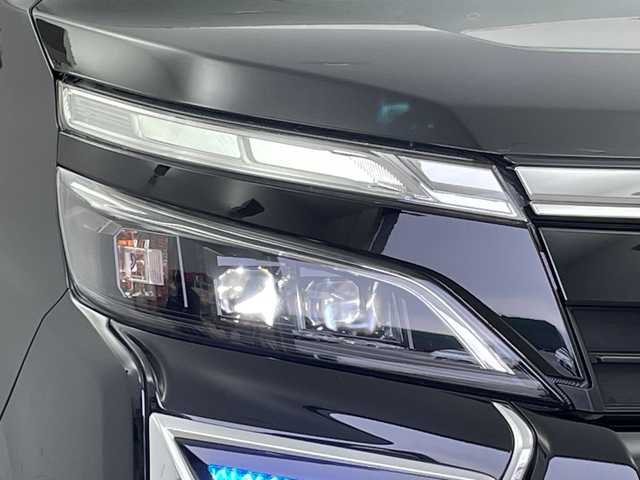 トヨタ ヴォクシー ハイブリッド ZS 煌Ⅱ 新潟県 2019(平31)年 7万km ブラック ALPAINE11型ナビ/BT/CD/DVD/フルセグ/ALPAINE12.8型フリップダウンモニター/バックカメラ/ドライブレコーダー前/トヨタセーフティセンス/コーナーセンサー前後/両側パワースライドドア/LEDヘッドライト/フォグランプ/純正フロアマット/シートヒーター/モデリスタエアロ