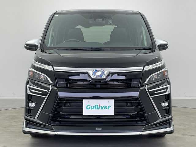 トヨタ ヴォクシー ハイブリッド ZS 煌Ⅱ 新潟県 2019(平31)年 7万km ブラック ALPAINE11型ナビ/BT/CD/DVD/フルセグ/ALPAINE12.8型フリップダウンモニター/バックカメラ/ドライブレコーダー前/トヨタセーフティセンス/コーナーセンサー前後/両側パワースライドドア/LEDヘッドライト/フォグランプ/純正フロアマット/シートヒーター/モデリスタエアロ