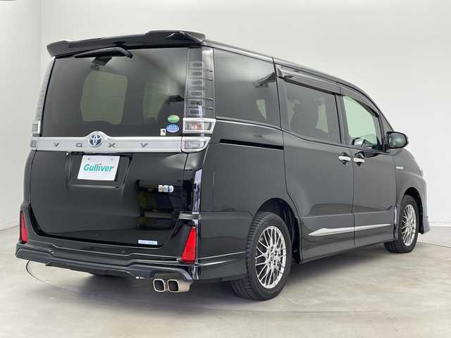 トヨタ ヴォクシー ハイブリッド ZS 煌Ⅱ 新潟県 2019(平31)年 7万km ブラック ALPAINE11型ナビ/BT/CD/DVD/フルセグ/ALPAINE12.8型フリップダウンモニター/バックカメラ/ドライブレコーダー前/トヨタセーフティセンス/コーナーセンサー前後/両側パワースライドドア/LEDヘッドライト/フォグランプ/純正フロアマット/シートヒーター/モデリスタエアロ