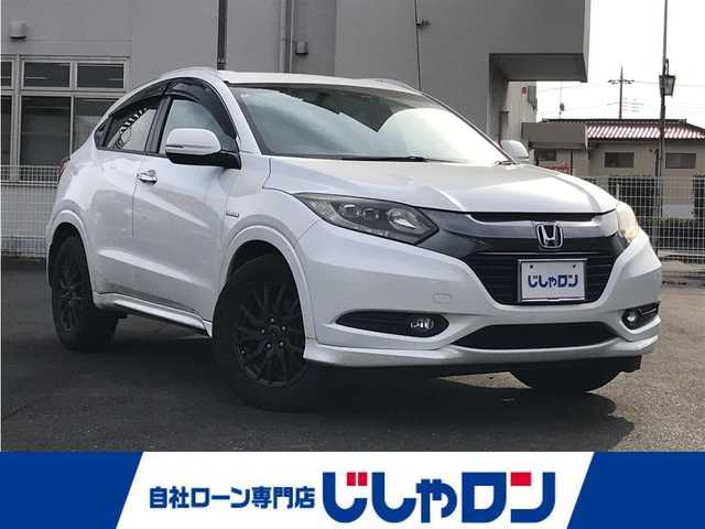 ホンダ ヴェゼル ハイブリッド Z 千葉県 2015(平27)年 14.4万km ホワイトオーキッドパール (株)IDOMが運営する【じしゃロン柏店】の自社ローン対象車両になります。こちらは現金ご利用時の価格です。/自社ローンご希望の方は別途その旨お申付け下さい。//禁煙車/純正フルセグナビ/（CD/DVD/AM/FMラジオ）/(Bluetooth)/スマートキー/プッシュスタート/バックカメラ/ＥＴＣ/クルーズコントロール/シティブレーキアクティブシステム/ルーフレール/シートヒーター/チップアップシート/ステアリングリモコン/電動格納ドアミラー/パワーウインドウ/オートライト/自動防眩ミラー