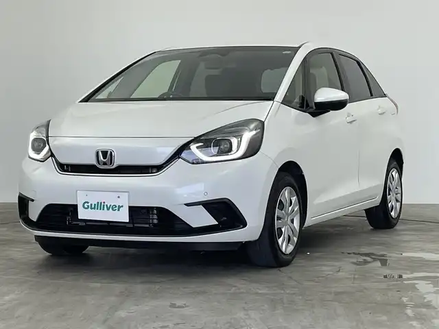 ホンダ フィット e:HEVホーム 群馬県 2022(令4)年 6.1万km プラチナホワイトパール 純正７インチナビ　バックカメラ　アダプティブクルーズコントロール　ＬＥＤライト　ＡＨＢ　ハーフレザーシート　ステアリングリモコン　走行運転支援　オートブレーキホールド　スマートキー　ＥＴＣ　禁煙
