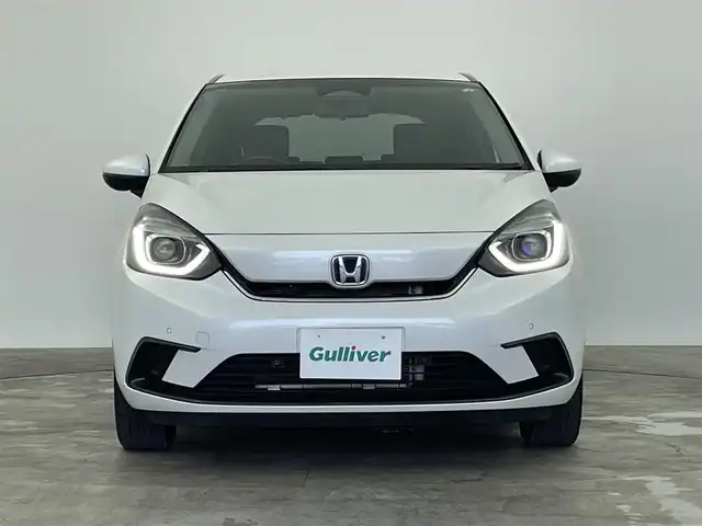 ホンダ フィット e:HEVホーム 群馬県 2022(令4)年 6.1万km プラチナホワイトパール 純正７インチナビ　バックカメラ　アダプティブクルーズコントロール　ＬＥＤライト　ＡＨＢ　ハーフレザーシート　ステアリングリモコン　走行運転支援　オートブレーキホールド　スマートキー　ＥＴＣ　禁煙