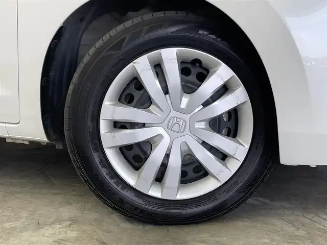 ホンダ フィット e:HEVホーム 群馬県 2022(令4)年 6.1万km プラチナホワイトパール 純正７インチナビ　バックカメラ　アダプティブクルーズコントロール　ＬＥＤライト　ＡＨＢ　ハーフレザーシート　ステアリングリモコン　走行運転支援　オートブレーキホールド　スマートキー　ＥＴＣ　禁煙