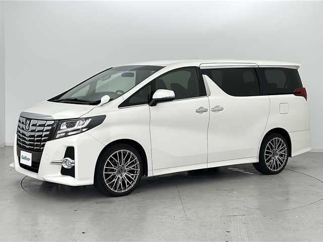 トヨタ アルファード S サイドリフトアップ 宮城県 2015(平27)年 12.8万km ラグジュアリーホワイトパールクリスタルシャインガラスフレーク Toyota Safety Sense/・プリクラッシュセーフティ			/・オートマチックハイビーム/純正12.8型ナビ/BT.DVD.SD.USB.HDMI/両側パワースライド/バックカメラ/フルセグTV/純正ビルトインETC/電動パーキングブレーキ/革巻ステアリング/ステアリングスイッチ/サイドリフトアップ/プッシュスタート/スマートキー/純正スターター/純正フロアマッド/社外20インチAW/クリアランスソナー/デアイサー/横滑り防止機能/アイドリングストップ/オットマン/LEDヘッドライト/フォグランプ