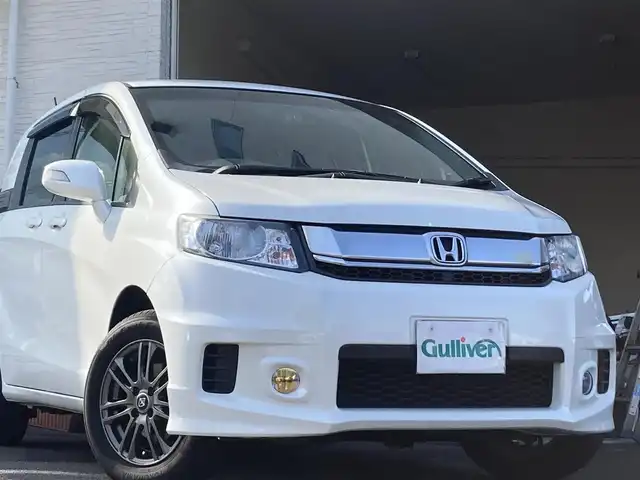 ホンダ フリード スパイク G プレミアムエディション 大分県 2016(平28)年 9.7万km ホワイトオーキッドパール ワンオーナー /両側パワースライドドア /社外15インチアルミホイール/オートライト/社外ドラレコ/純正ビルトインETC/ナビ/フルセグTV/Bluetooth/5月3日から5月7日までお休みの為、書類発送及び車両搬出は5月8日以降になります。