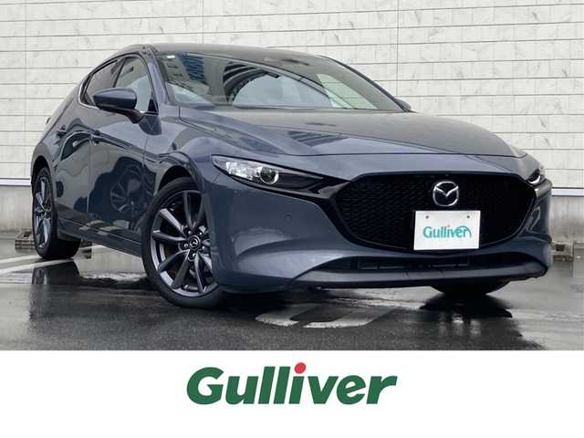 マツダ マツダ３ファストバック 15S ツーリング 静岡県 2020(令2)年 3.3万km ポリメタルグレーM i-ACTIVSENSE/純正SDナビ/　AM FM CD DVD Bluetooth USB HDMI/フルセグTV/ビルトインETC/LEDオートヘッドランプ/レーダークルーズコントロール/ヘッドアップディスプレイ/純正18インチアルミホイール/スマートキー2本/前後方クリアランスソナー/ワンオーナー/アラウンドビューモニター/前後方ドライブレコーダー