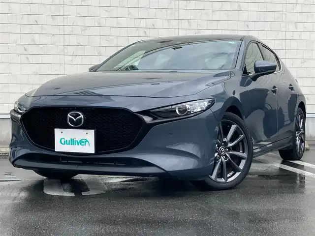 マツダ マツダ３ファストバック 15S ツーリング 静岡県 2020(令2)年 3.3万km ポリメタルグレーM i-ACTIVSENSE/純正SDナビ/　AM FM CD DVD Bluetooth USB HDMI/フルセグTV/ビルトインETC/LEDオートヘッドランプ/レーダークルーズコントロール/ヘッドアップディスプレイ/純正18インチアルミホイール/スマートキー2本/前後方クリアランスソナー/ワンオーナー/アラウンドビューモニター/前後方ドライブレコーダー