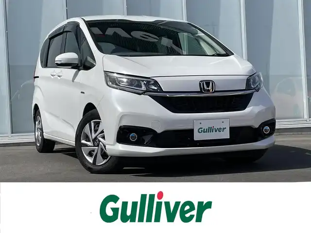 ホンダ フリード ハイブリット G ホンダセンシング 神奈川県 2020(令2)年 3.8万km プラチナホワイトパール MC後モデル/Cパッケージ/ワンオーナー/純正９インチナビＴＶ/（ＤＶＤ／Ｂｌｕｅｔｏｏｔｈ／ＳＤ／ＨＤＭＩ）/純正１１．６インチ後席モニター/(VM-185EN)/両側パワースライドドア/ACC(アダプティブクルーズコントロール)/LKAS（車線維持支援システム）/アクティブコーナリングライト/バックカメラ/純正LEDヘッド&フォグライト　/純正エンジンスターター/(RS-16Jシリーズ)/オートリトラミラー/ビルトインETC/R3/4/5/6点検記録