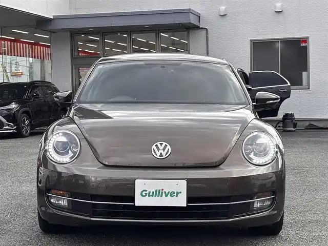 フォルクスワーゲン ザ・ビートル デザイン 熊本県 2014(平26)年 8.6万km グラシオーサブラウンメタリック 社外SDナビ（CN-R300D）/【フルセグTV/CD/DVD/SDオーディオ】/バックカメラ/純正16インチアルミホイール/HIDヘッドライト/ETC/ドライブレコーダー/フロアマット/取扱説明書/リモコンキー