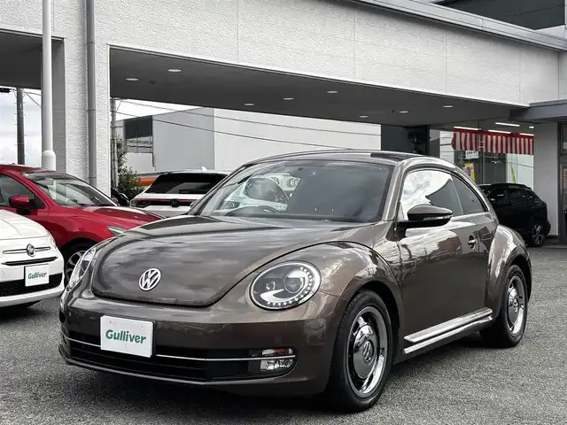 フォルクスワーゲン ザ・ビートル デザイン 熊本県 2014(平26)年 8.6万km グラシオーサブラウンメタリック 社外SDナビ（CN-R300D）/【フルセグTV/CD/DVD/SDオーディオ】/バックカメラ/純正16インチアルミホイール/HIDヘッドライト/ETC/ドライブレコーダー/フロアマット/取扱説明書/リモコンキー
