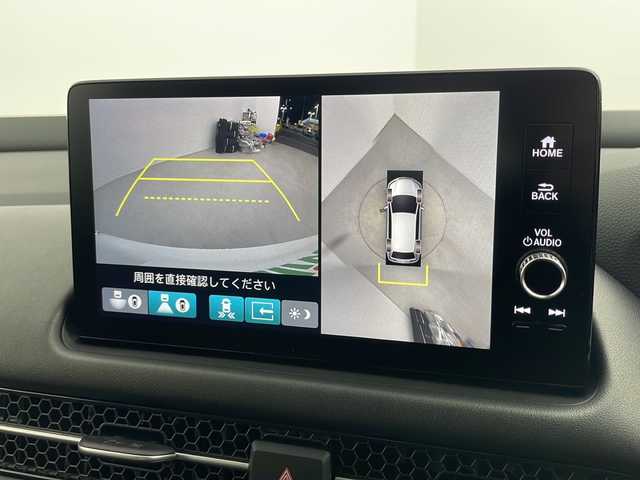 ホンダ ＺＲ－Ｖ ハイブリッド e:HEV Z 愛知県 2024(令6)年 0.3万km プラチナホワイトパール 純正9インチナビ/マルチビューカメラシステム/フルセグTV・Bluetooth/BOSEサウンド/ワイヤレス充電器/ETC2.0/本革シート/運転席助手席パワーシート/運転席助手席シートヒーター/ハンズフリーアクセステールゲート/純正18インチアルミホイール/ホンダセンシング/衝突軽減ブレーキ/先行車発進お知らせ/歩行者事故低減ステアリング/路外逸脱抑制/標識認識/渋滞追従機能付アダプティブクルーズコントロール/車線維持支援システム/トラフィックジャムアシスト(渋滞運転支援)/ブラインドスポットインフォメーション/後退出庫サポート/ヒルディセントコントロール/アダプティブドライビングビーム/LEDヘッドライト/オートライト/革巻きステアリング/パドルシフト/スマートキー/プッシュスタート/スペアキー/保証書・取扱説明書