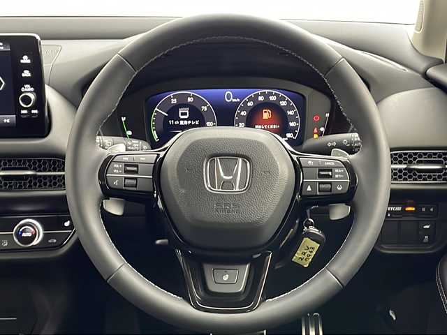ホンダ ＺＲ－Ｖ ハイブリッド e:HEV Z 愛知県 2024(令6)年 0.3万km プラチナホワイトパール 純正9インチナビ/マルチビューカメラシステム/フルセグTV・Bluetooth/BOSEサウンド/ワイヤレス充電器/ETC2.0/本革シート/運転席助手席パワーシート/運転席助手席シートヒーター/ハンズフリーアクセステールゲート/純正18インチアルミホイール/ホンダセンシング/衝突軽減ブレーキ/先行車発進お知らせ/歩行者事故低減ステアリング/路外逸脱抑制/標識認識/渋滞追従機能付アダプティブクルーズコントロール/車線維持支援システム/トラフィックジャムアシスト(渋滞運転支援)/ブラインドスポットインフォメーション/後退出庫サポート/ヒルディセントコントロール/アダプティブドライビングビーム/LEDヘッドライト/オートライト/革巻きステアリング/パドルシフト/スマートキー/プッシュスタート/スペアキー/保証書・取扱説明書