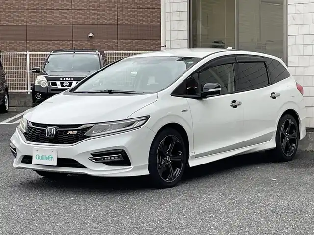 ホンダ ジェイド ハイブリッド RS ホンダセンシング 福岡県 2019(平31)年 3.1万km プラチナホワイトパール 無限ドアハンドルプロテクター/黒ハーフレザーシート/純正メモリナビGathers【VXM-194VFi】/(AM/FM/Bluetooth/CD/DVD/フルセグTV】/ビルトインETC/バックカメラ/パドルシフト/オートライト/衝突軽減ブレーキ(CMBS)/路外逸脱抑制/アダプティブクルーズコントロール/車両接近通報装置/車線維持支援システム(LKAS)/クリアランスソナー/コーナーセンサー/盗難防止装置/横滑り防止機能/電格ウィンカーミラー/プッシュスタート/純正フロアマット/純正１８インチアルミホイール/ステアリングスイッチ/フロントフォグランプ/ドアバイザー/純正前方ドライブレコーダーGathers【DRH-189N】/ナビ取扱説明書/ドラレコ取扱説明書/取扱説明書/保証書