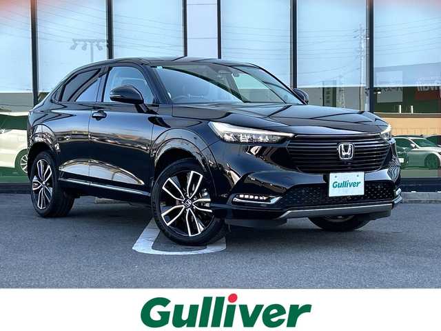 ホンダ ヴェゼル ハイブリッド e:HEV Z 岐阜県 2023(令5)年 2.6万km クリスタルブラックパール 登録時走行距離25711ｋｍ/純正ディスプレイナビ/全方位カメラ/デジタルインナーミラー/ハーフレザー/クルーズコントロール/ステアリングヒーター/コーナーセンサー/純正アルミホイール/シートヒーター/電動リアゲート/衝突軽減システム/Bluetooth/USB端子/ETC2.0/前後純正ドライブレコーダー/ウィンカーミラー/純正フロアマット/オートライト/オートハイビーム/LEDヘッドライト/レーンキープアシスト/スマートキー/スペアキー/プッシュスタート/保証書/取り扱い説明書/記録簿